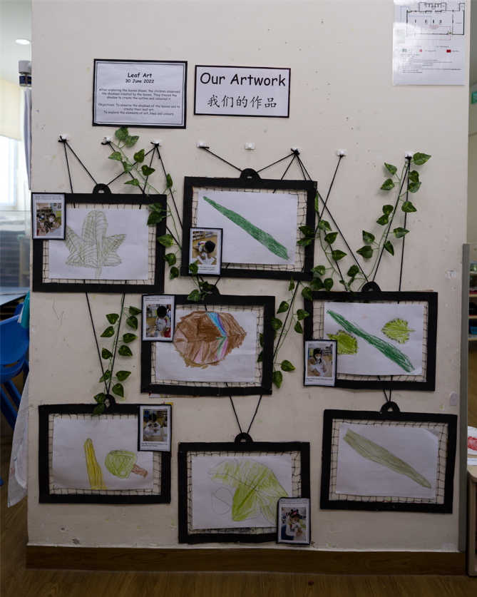 Wall filled with artworks done by children, this invites them to reflect and start conversations